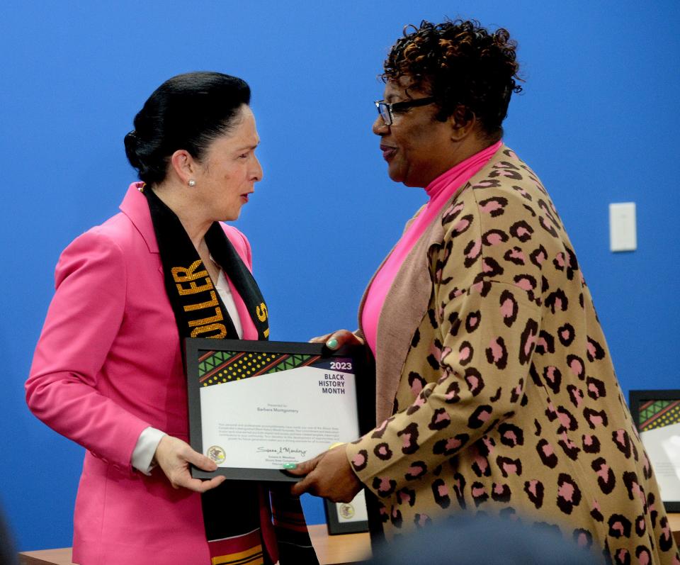 Illinois State Comptroller Susana Mendoza, left, hands an award for Celebrate Black History Month  to Southeast High School Coach Barbara Montgomery Thursday Feb. 23, 2023 for Montgomery's work in Springfield.