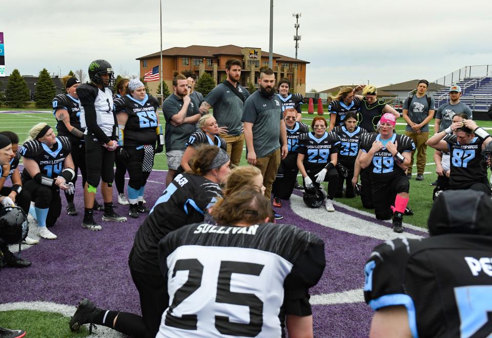 TJ Marler, head coach, talks with the Sioux Falls Snow Leopards after their first home football game of the season on Saturday, May 7, 2022, at the University of Sioux Falls football field.
