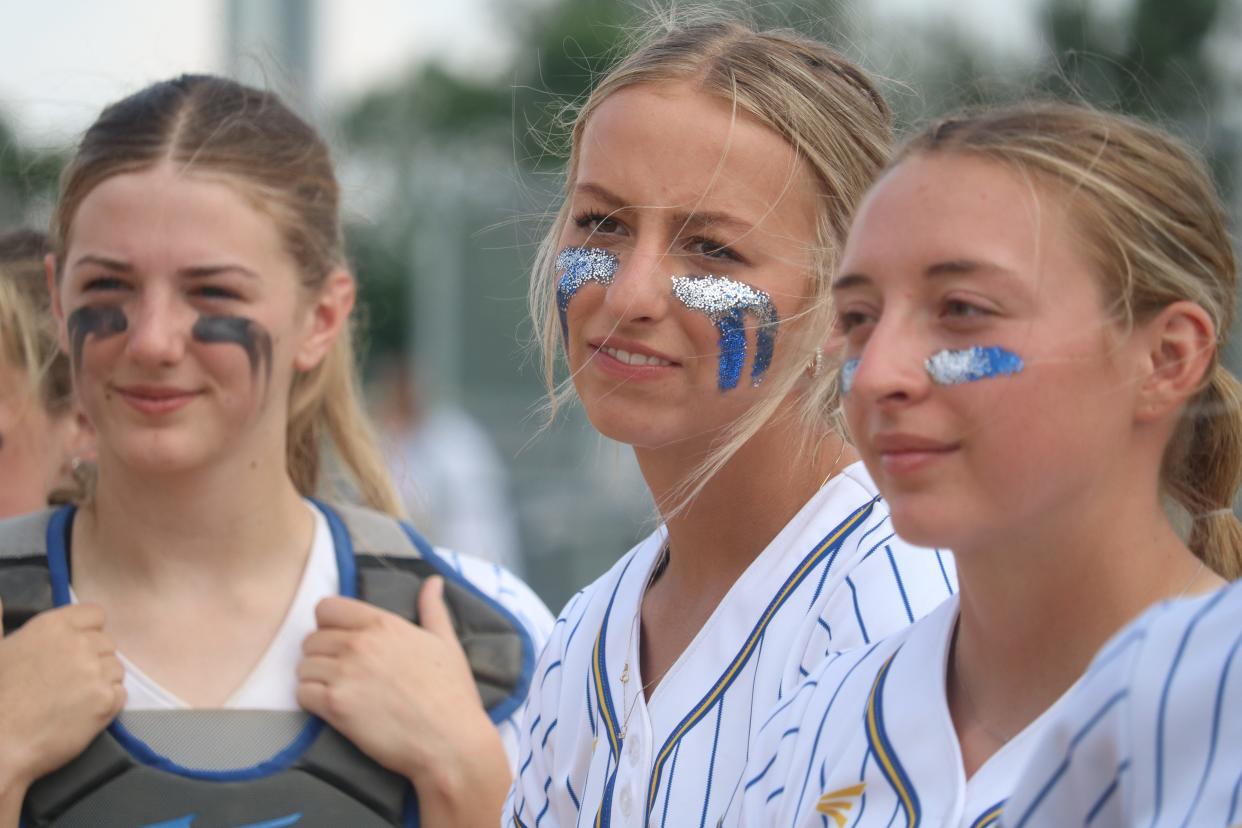 Castlewood softball players, from left, Lilly Jacobsen, Maddie Horn and Mackenzie Everson take in the moment after the Warriors defeated Alcester-Hudson 3-2 to win the state Class B championship in the first South Dakota High School Activities Association sanctioned state softball tourney that concluded on Saturday, June 3, 2023 at Aberdeen.