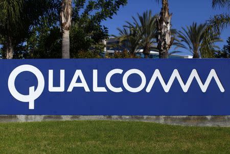 A Qualcomm sign is pictured in front of one of its many buildings in San Diego, California November 5, 2014. REUTERS/Mike Blake