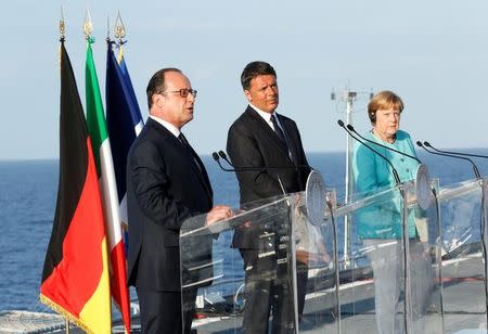 Italian Prime Minister Matteo Renzi, German Chancellor Angela Merkel (R) and French President Francois Hollande (L) lead a news conference on the Italian aircraft carrier Garibaldi off the coast of Ventotene island, central Italy, August 22, 2016. REUTERS/Remo Casilli