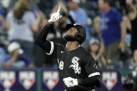 Chicago White Sox's Luis Robert celebrates after hitting a two-run home run during the tenth inning of a baseball game against the Kansas City Royals Monday, May 16, 2022, in Kansas City, Mo. (AP Photo/Charlie Riedel)