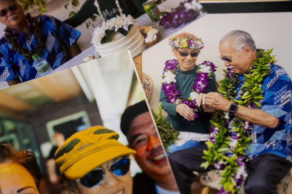 Photos of Sharlene Rabang, who was named as the 100th victim of the Lahaina wildfires after dying weeks after fleeing her home, Tuesday, Dec. 5, 2023, are seen at her husband Weslee Chinen's family home in Waipahu, Hawaii. Rabang, who had a previous history of cancer, COVID and high blood pressure, was not originally listed as a victim until her family fought to have her included, citing smoke inhalation as a contributing factor. Chinen was in Oahu at the time of the fires, and Rabang's son Brandon had to convince her to flee. (AP Photo/Lindsey Wasson)