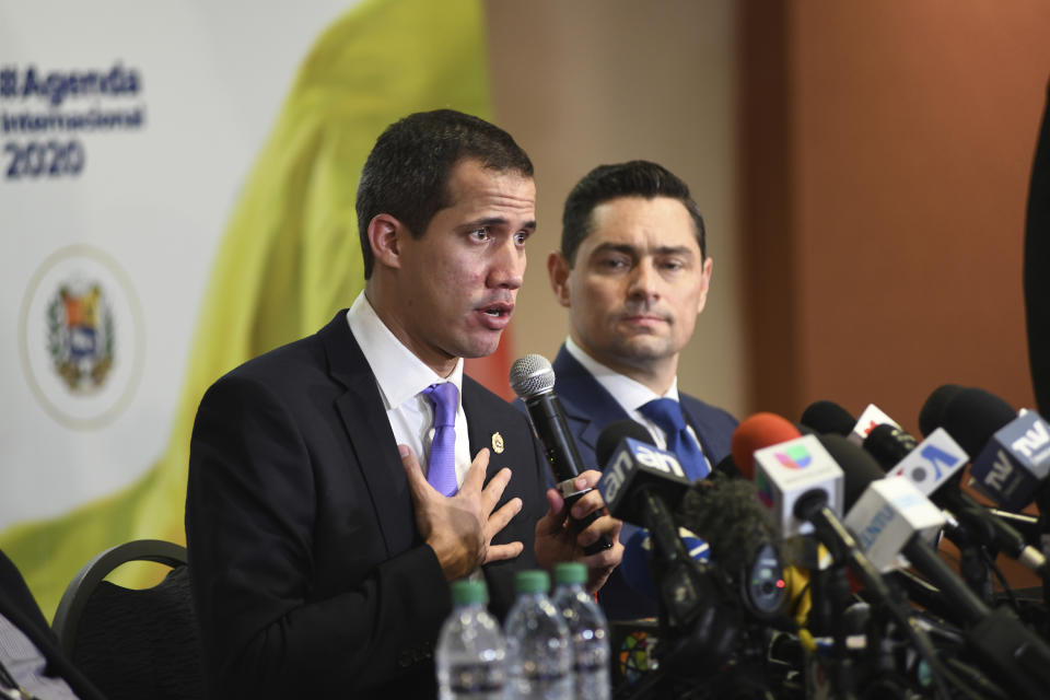 Venezuela's interim President Juan Guaido speaks to the media after a rally in Miami, Saturday, Feb. 1, 2020. Guaido told a large crowd of cheering expatriates in Miami on Saturday that he will soon make his return to Caracas from an international tour with the “world's backing” to oust President Nicolás Maduro. (AP Photo/Gaston De Cardenas)
