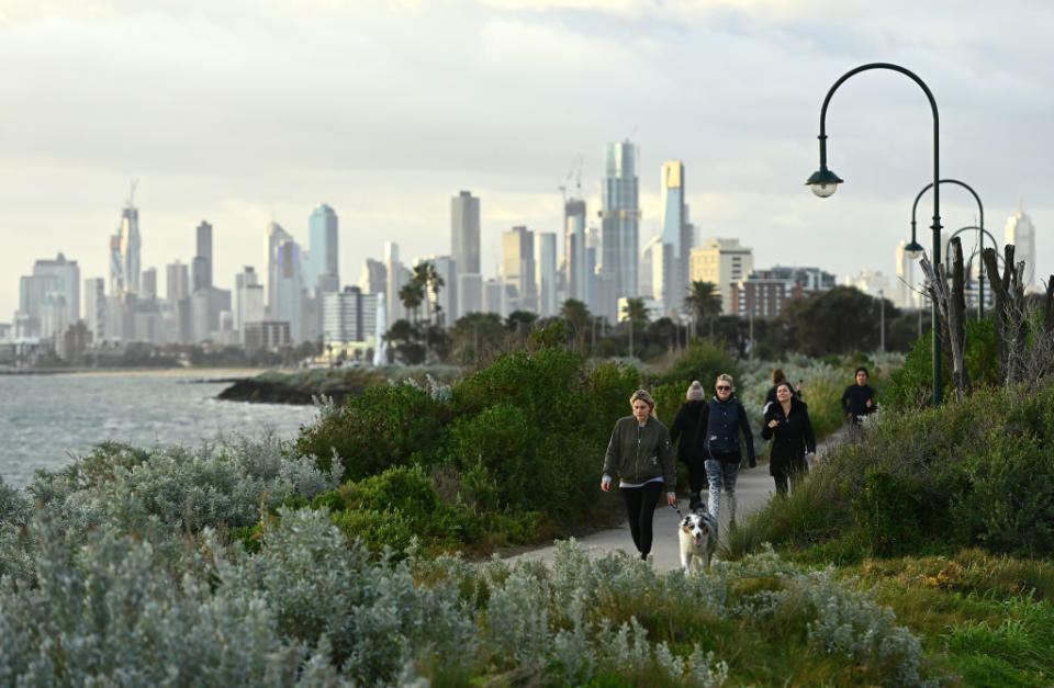 Melburnians exercise along Elwood Beach in Melbourne. 