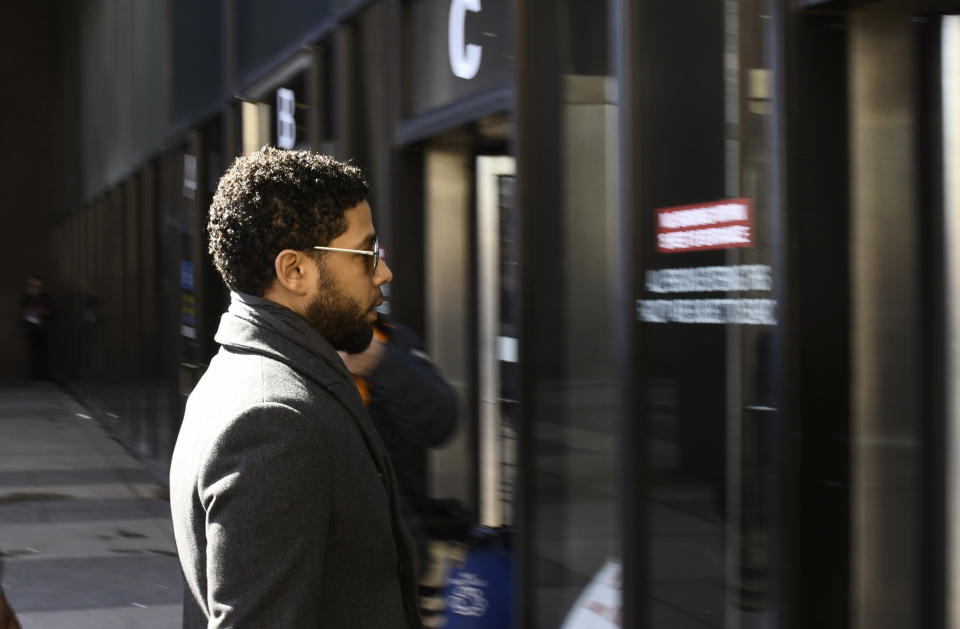 "Empire" actor Jussie Smollett, center, arrives at Leighton Criminal Court Building for a hearing to discuss whether cameras will be allowed in the courtroom during his disorderly conduct case on Tuesday, March 12, 2019, in Chicago. A grand jury indicted Smollett last week on 16 felony counts accusing him of lying to the police about being the victim of a racist and homophobic attack by two masked men in downtown Chicago.(AP Photo/Matt Marton)