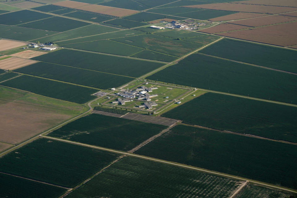 In this aerial photo, agricultural fields surround a cell block on the grounds of the Louisiana State Penitentiary, Friday, July 21, 2023, in Angola, La. While many companies buy unknowingly through third-party suppliers, mammoth commodity traders like Cargill, Bunge, Louis Dreyfus, Archer Daniels Midland and Consolidated Grain and Barge, in recent years, have scooped up millions of dollars’ worth of soy, corn and wheat straight from prison farms. (AP Photo/Gerald Herbert)