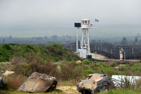 FILE PHOTO: A United Nations peacekeeper observation tower is seen next to the Quneitra border crossing between near the ceasefire line between Israel and Syria in the Israeli-occupied Golan Heights March 25, 2019. REUTERS/Ammar Awad/File Photo