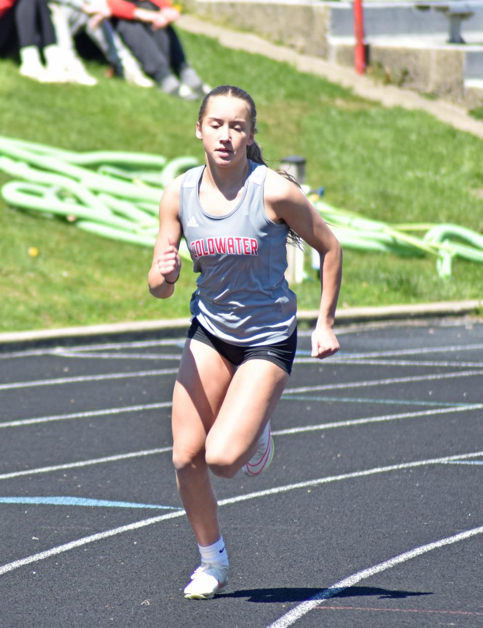 Coldwater's Ella Grabowski, shown here running the 400 meter dash, broke the CHS school record in the long jump at Friday's Portage Northern Invite