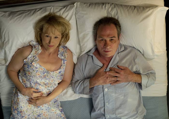 Meryl Streep and Tommy Lee Jones lying next to each other in bed, as seen in the film "Hope Springs"