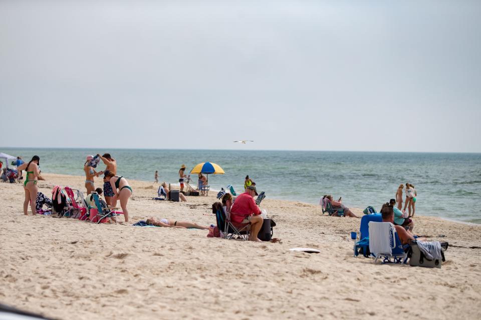 People enjoy the warmer weather at St. George Island on Thursday, March 14, 2024.