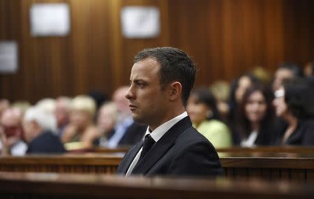Olympic and Paralympic track star Oscar Pistorius listens to Judge Thokozile Masipa deliver her verdict at the North Gauteng High Court in Pretoria September 11, 2014. REUTERS/Phill Magakoe/Pool
