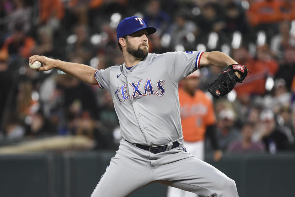 Texas Rangers starting pitcher Jordan Lyles (24) delivers a pitch during the first inning of a baseball game against the Baltimore Orioles, Saturday, Sept. 25, 2021, in Baltimore. (AP Photo/Terrance Williams)