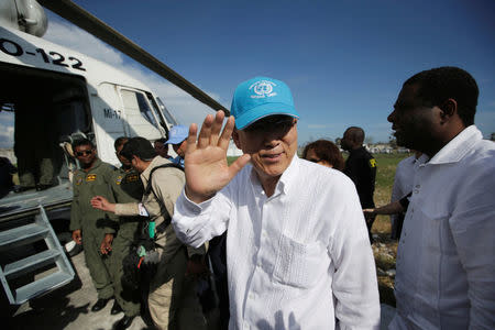 UN Secretary General Ban Ki Moon waves before his departure from MINUSTAH base at the end of a visit after Hurricane Matthew in Les Cayes, Haiti, October 15, 2016. REUTERS/Andres Martinez Casares