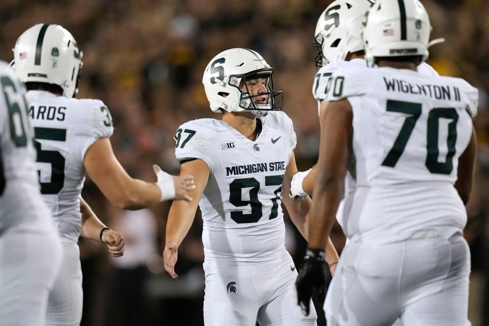 Michigan State kicker Jonathan Kim (97) celebrates with teammates after kicking a field goal during the first half at Kinnick Stadium in Iowa City, Iowa, on Saturday, Sept. 30, 2023.