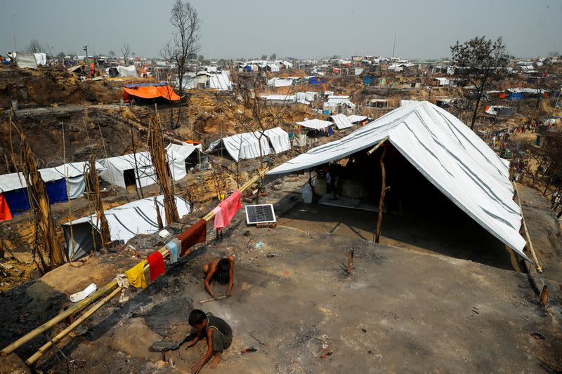 The Wider Image: 'Can't take this pain': Rohingya mother searches for son after refugee camp blaze