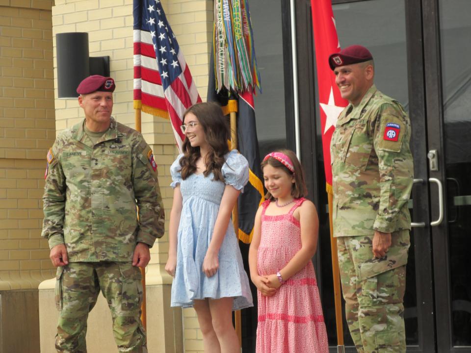 Maj. Gen. Christopher LaNeve, far left and Command Sgt. Maj. Randolph Delapena, far right, congratulate the 82nd Airborne Division's Junior Paratroopers of the Year, Savanna Oen, second from left and Anna-Marie Nolen, second from right, during a ceremony Tuesday, May 23, 2023, at Fort Bragg.