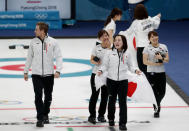 Curling - Pyeongchang 2018 Winter Olympics - Women's Bronze Medal Match - Britain v Japan - Gangneung Curling Center - Gangneung, South Korea - February 24, 2018 - Japan's coach J.D. Lind celebrates with vice-skip Chinami Yoshida, skip Satsuki Fujisawa and second Yumi Suzuki after the team won. REUTERS/Cathal Mcnaughton