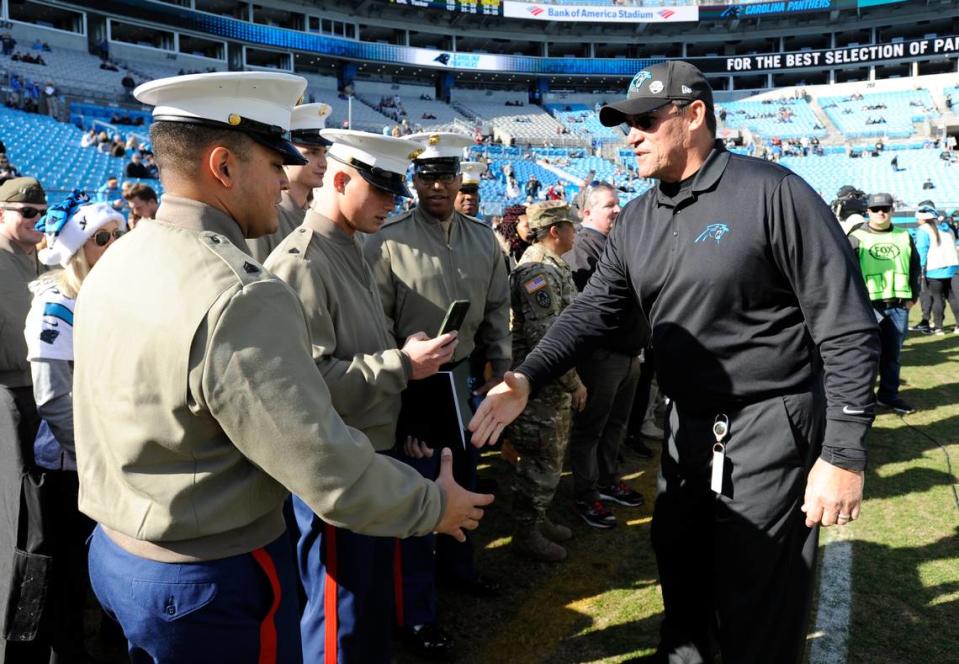 Carolina Panthers head coach Ron Rivera greets members of the military before Sunday’s 24-10 loss to the Atlanta Falcons in Charlotte. Mike McCarn/AP