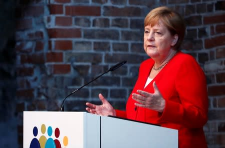 German Chancellor Merkel attends a ceremony to mark 50 years of German development aid in Berlin