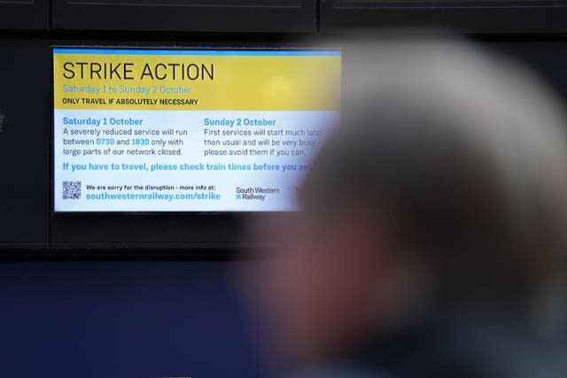 A sign warning passengers at Waterloo Station in London, of planned strikes