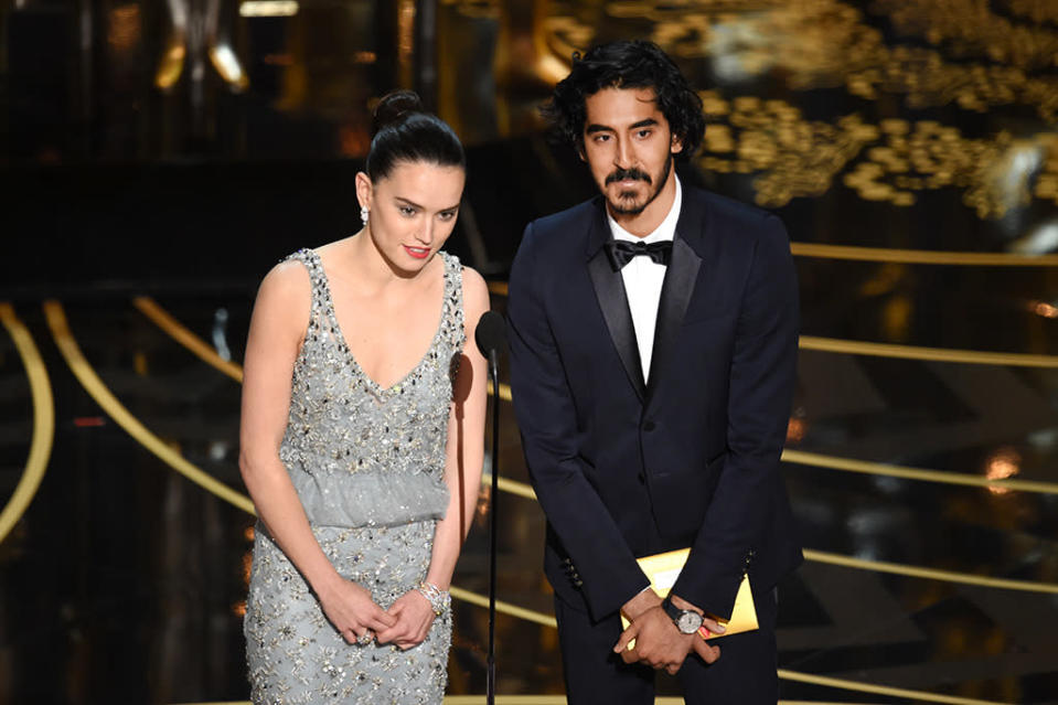 Daisy Ridley and Dev Patel speak onstage during the 88th Annual Academy Awards at the Dolby Theatre on February 28, 2016 in Hollywood, California.  