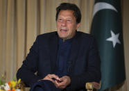 Pakistan's Prime Minister Imran Khan speaks to The Associated Press, in Islamabad, Pakistan, Monday, March 16, 2020. Khan said Monday he fears the new coronavirus will devastate developing nations' economies, and warned richer economies to prepare to write off the debts of the world's poorer countries. In the interview he also called for an end to sanctions on Iran saying they were crippling the poor nation's ability to even contain the spread of the coronavirus. For most people, the new coronavirus causes only mild or moderate symptoms. For some it can cause more severe illness. (AP Photo/B.K. Bangash)