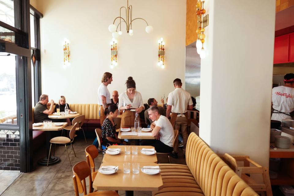 Patrons dine at Saffy's restaurant indoors.