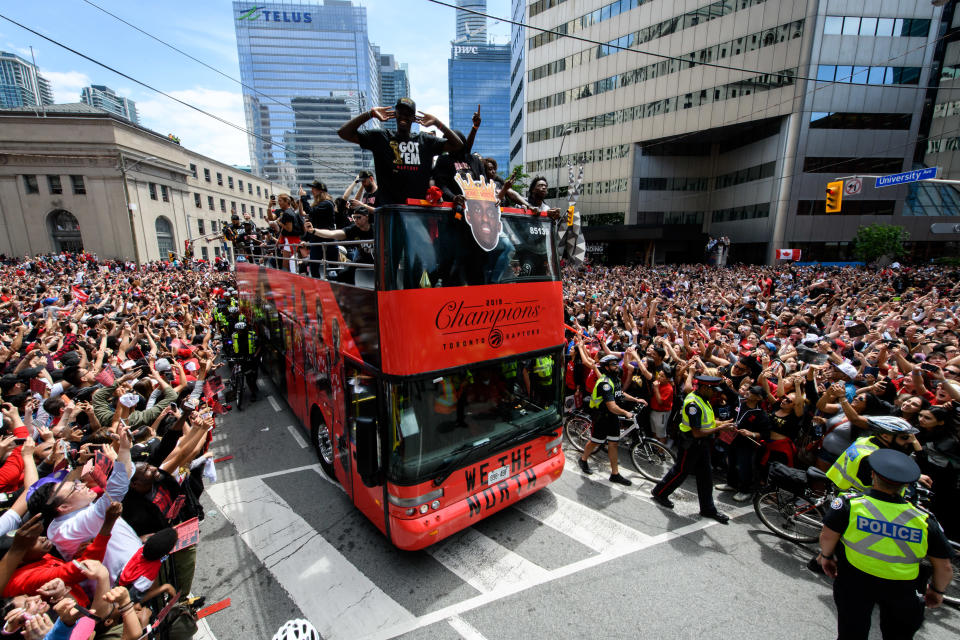 Toronto Raptors player Pascal Siakam rides on the bus during the Toronto Raptors Championship parade on June 13, 2019 in Toronto, ON, Canada. (Photo by Julian Avram/Icon Sportswire via Getty Images)