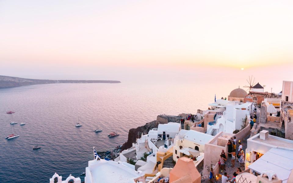 Raspberry skies: Santorini Sailing has a sunset cruise from £33 per person - Gemma Ferrando