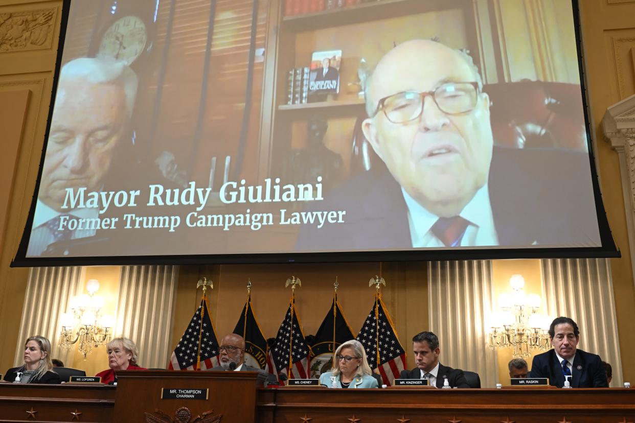 A video of Giuliani's testimony is displayed on a screen during Tuesday's select committee hearing.