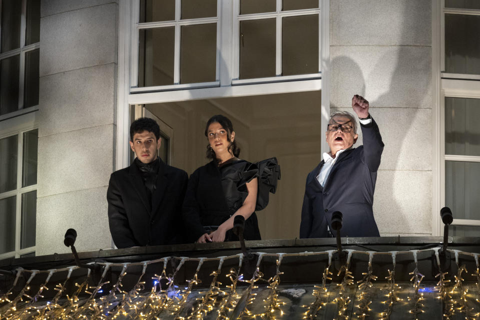 Family of Nobel Peace Prize winner Narges Mohammadi, husband Taghi Rahmani and their children Ali and Kiana Rahmani, center, watch a torchlight procession in honor of the Nobel Peace Prize laureate in Oslo, Norway, Sunday Dec. 10, 2023. Narges Mohammadi was awarded the 2023 Nobel Peace Prize in October for her decades of activism despite numerous arrests by Iranian authorities and spending years behind bars. She is renowned for campaigning for women's rights and democracy in her country, as well as fighting against the death penalty. (Hanna Johre/NTB via AP)