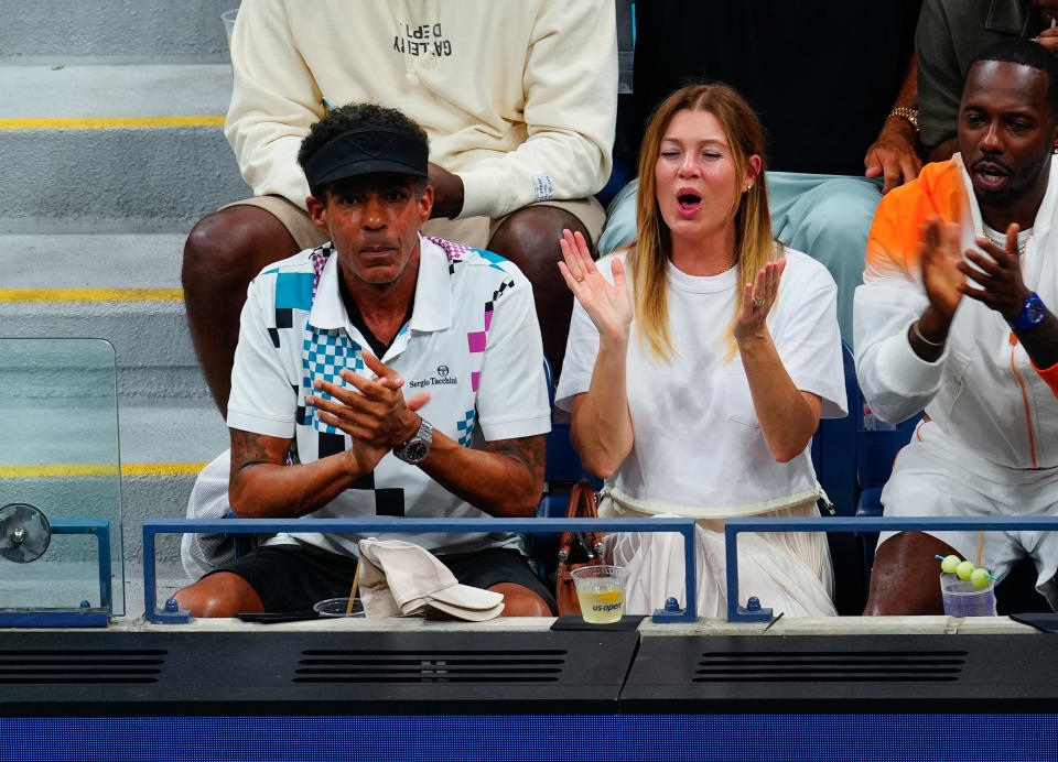 Ellen Pompeo and Chris Ivery cheering