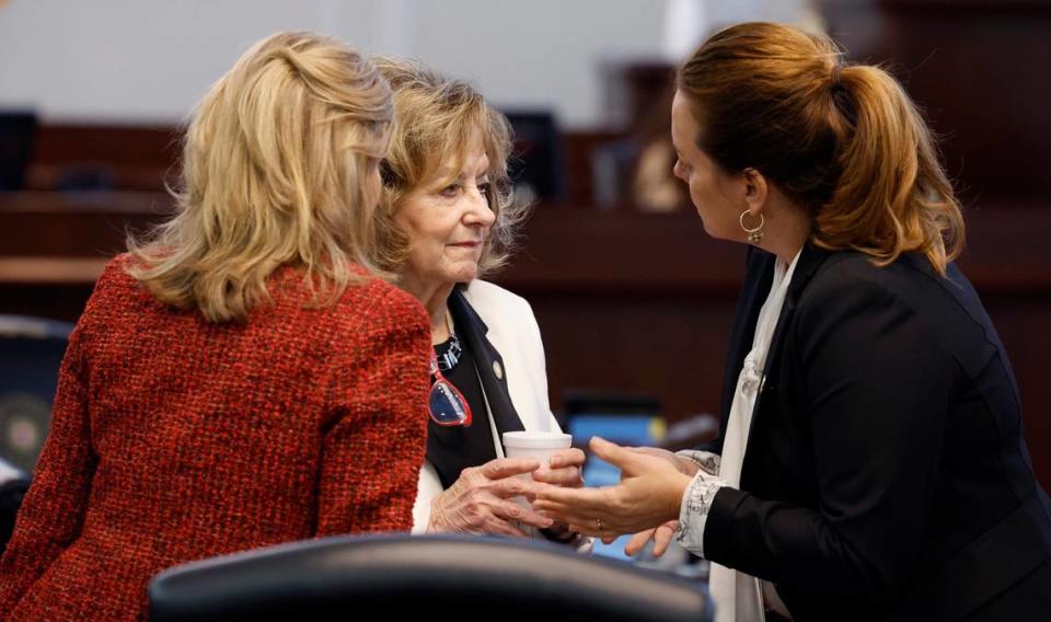 From left, N.C. Senators Lisa Barnes, Joyce Krawiec and Vickie Sawyer confer before the start of the afternoon session at the N.C. Legislature in Raleigh, N.C. Thursday, May 4, 2023.