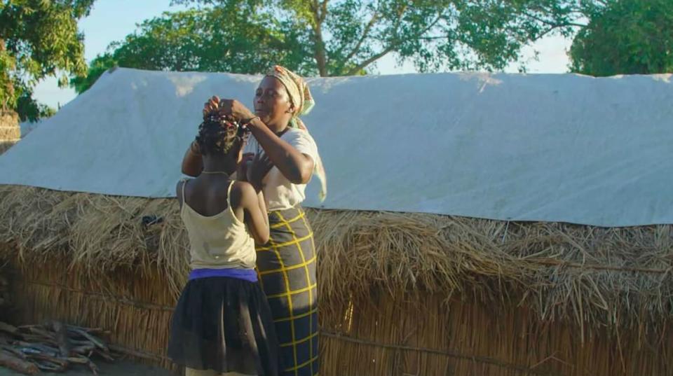 <div class="inline-image__caption"><p>Aunt Ana Maria Biche doing Maria's hair</p></div> <div class="inline-image__credit">Nyasha Kadandara</div>