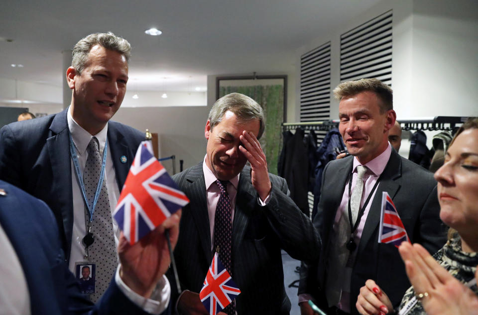 Brexit Party leader Nigel Farage waves a British flag ahead of a vote on the Withdrawal Agreement at the European Parliament in Brussels, Belgium January 29, 2020. REUTERS/Yves Herman