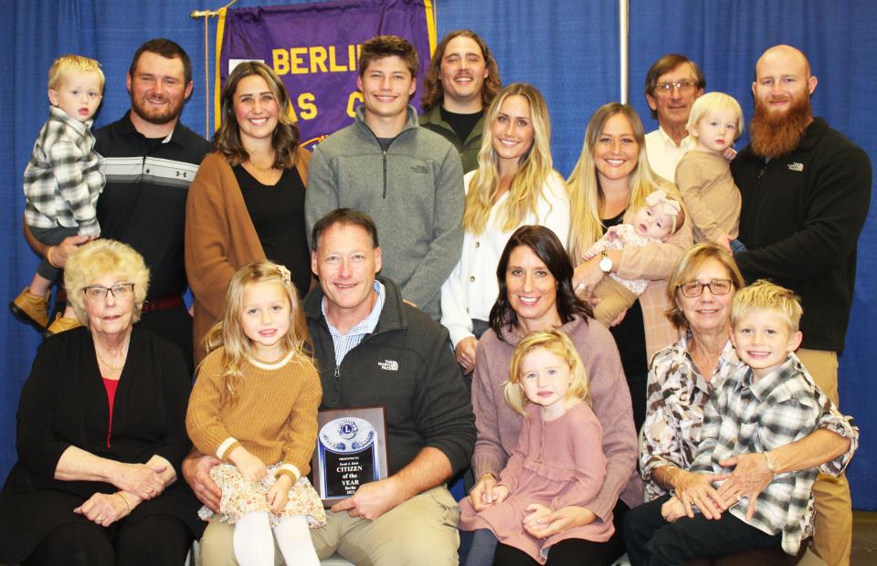 Scott Etris was supported by his family after receiving the Berlin Lions' Outstanding Citizen Award on Nov. 2 in Berlin. They are from left, front: Suzanne Etris, Scott Etris (holding Cora Craig), Michelle Etris (holding Finley Stockwell); and Roberta Wyant (holding Camden Craig). In back: Jacob Craig (holding Crew Craig), Laura Craig, Isaac Etris, Matthew Roland, Jenna Etris, Ashley Stockwell (holding Sunnie Stockwell), Dave Wyant, and Nick Stockwell (holding Theo Stockwell).