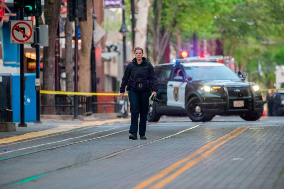 Sacramento Police Chief Kathy Lester walks the scene of the mass shooting in downtown Sacramento that left six dead on Sunday, April 3, 2022.