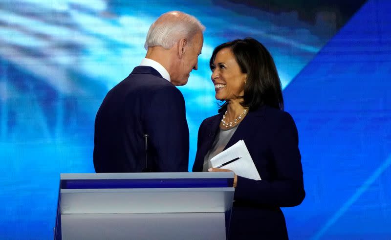 FILE PHOTO: Former Vice President Biden talks with Senator Harris after the conclusion of the 2020 Democratic U.S. presidential debate in Houston, Texas, U.S.