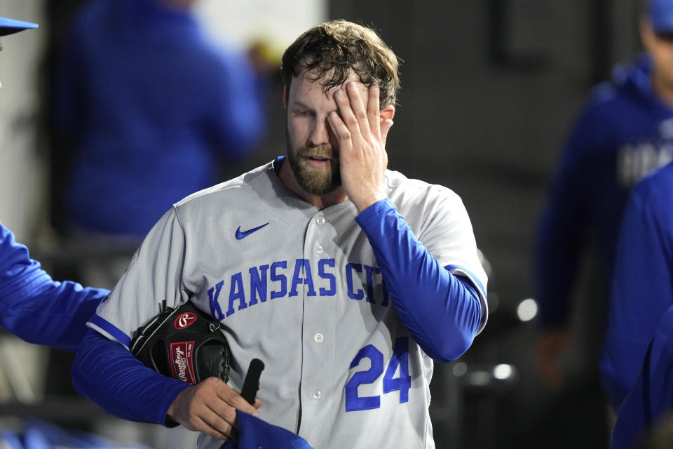 Kansas City Royals starting pitcher Jordan Lyles walks through the dugout after being pulled during the sixth inning in the second game of a baseball doubleheader against the Chicago White Sox Tuesday, Sept. 12, 2023, in Chicago. (AP Photo/Charles Rex Arbogast)