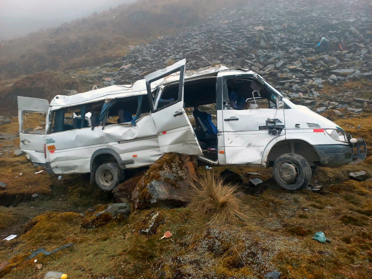 A van lays in ruins after falling off a cliff while transporting tourists from Machu Picchu to Cusco, Peru  (AP)