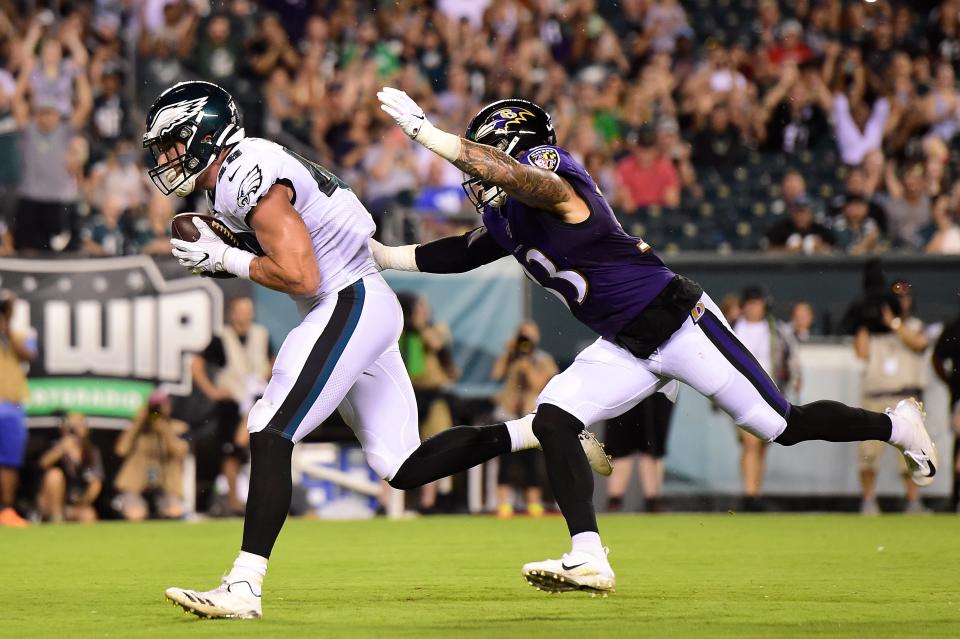 Alex Ellis #48 of the Philadelphia Eagles catches a touchdown pass against Bennett Jackson #33 of the Baltimore Ravens during a preseason game at Lincoln Financial Field on August 22 in Philadelphia.