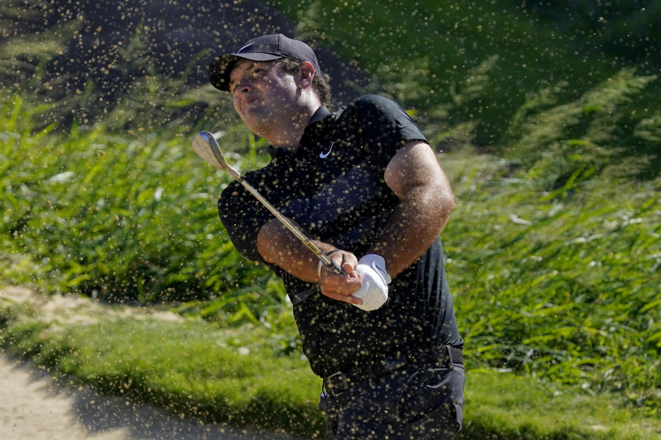 Patrick Reed hits out of the 11th green bunker during final round of the Tournament of Champions golf event, Sunday, Jan. 5, 2020, at Kapalua Plantation Course in Kapalua, Hawaii. (AP Photo/Matt York)