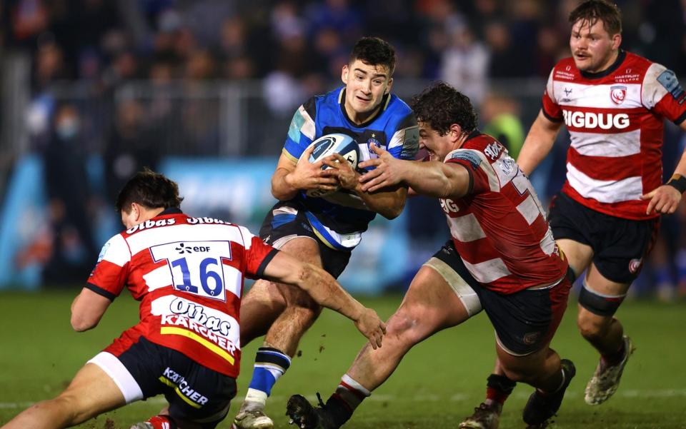 Orlando Bailey of Bath is held up whilst running with the ball during the Gallagher Premiership Rugby match between Bath Rugby and Gloucester Rugby at The Recreation Ground on December 26, 2021 in Bath, England.  - GETTY IMAGES