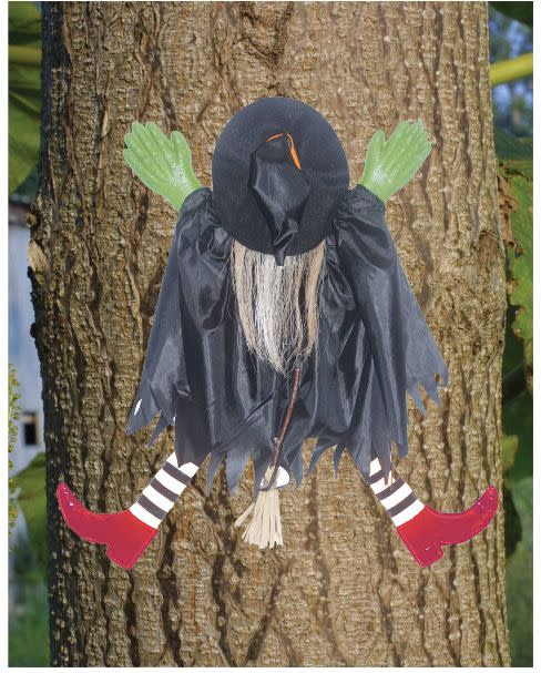 Get it here from <a href="https://www.target.com/p/halloween-tree-trunk-witch-with-red-shoes/-/A-51200536#lnk=newtab" target="_blank">Target</a>, $14.