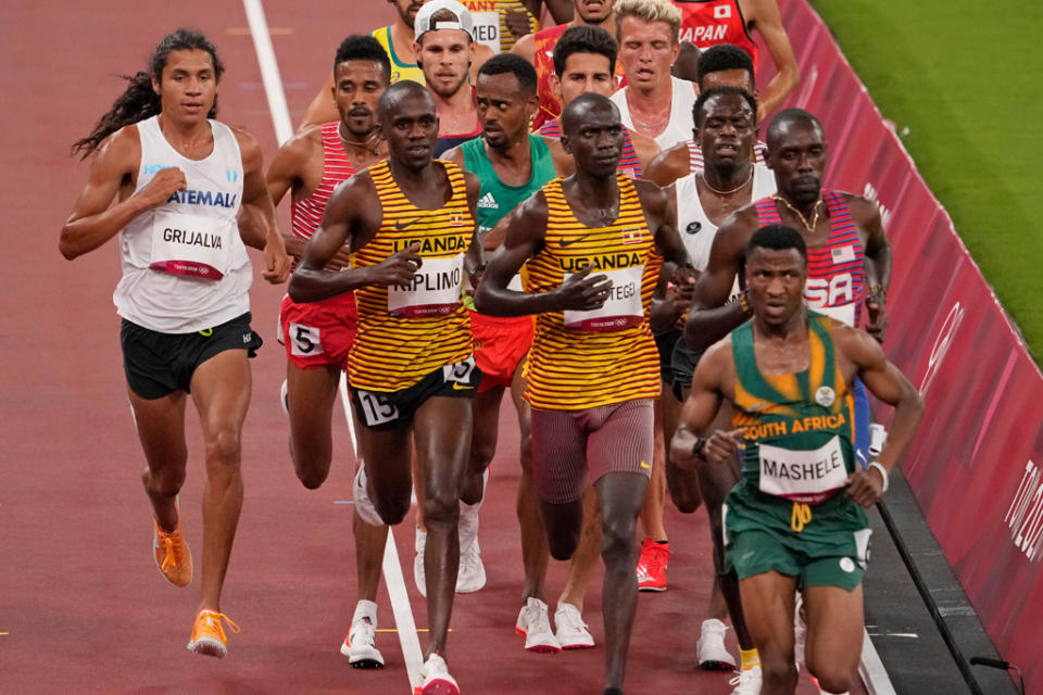 Luis Grijalva (far left) competes in a men’s 5,000-meter heat at the Tokyo Olympics. - Credit: AP Photo/Charlie Riedel