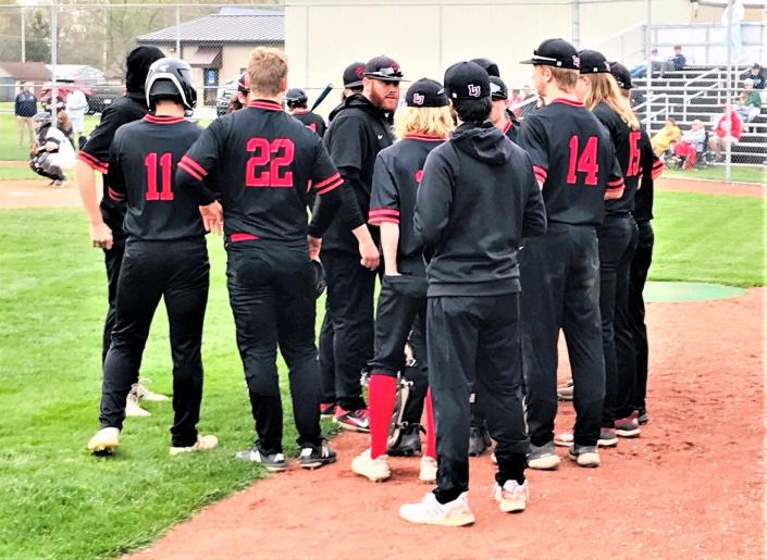 Liberty Union baseball coach Justin Miller talks with his team during a recent game. The Lions, ranked No. 2 in the state Ohio High School Baseball Coaches Association Division III poll, earned the No. 1 seed in Sunday&#39;s Central District tournament draw.