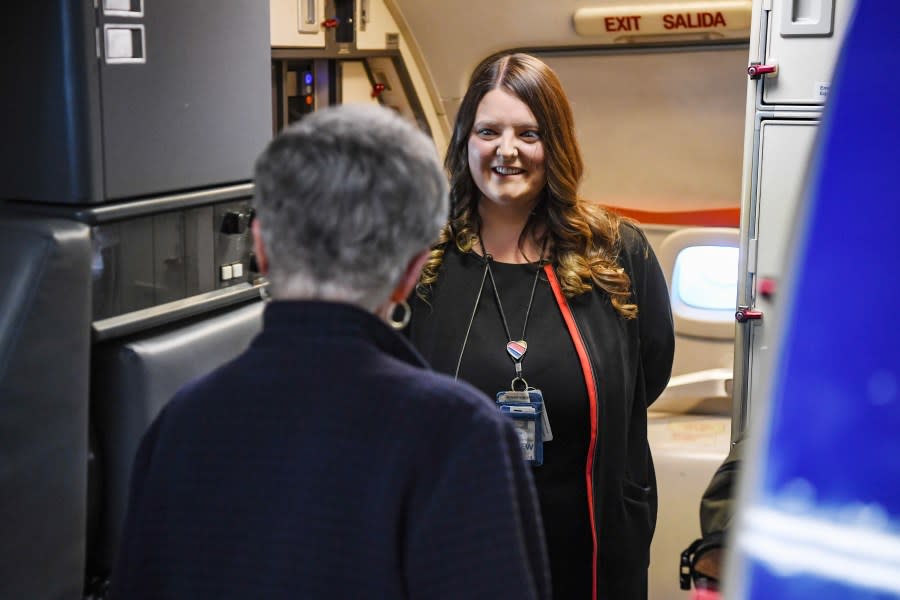 <em>Hospitality Hero award recipient Southwest Airlines flight attendant Brittany Tullis greets embarking passengers at Harry Reid International Airport on November 2, 2023, in Las Vegas, Nevada. (Sam Morris, LVCVA Archive)</em>