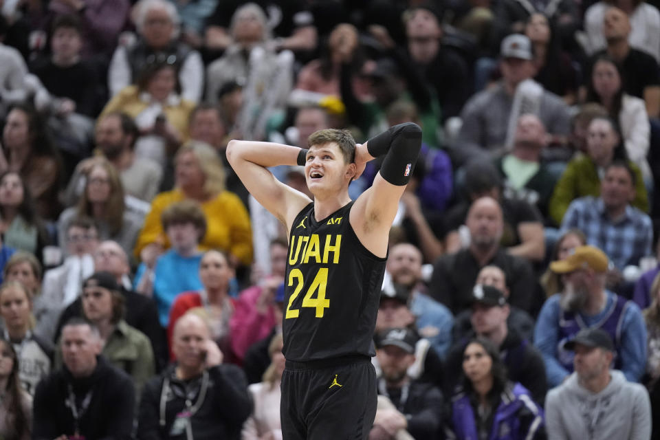 Utah Jazz center Walker Kessler reacts after committing a foul against the Los Angeles Lakers during the second half of an NBA basketball game Wednesday, Feb. 14, 2024, in Salt Lake City. (AP Photo/Rick Bowmer)