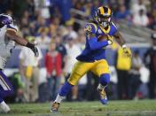 September 27, 2018; Los Angeles, CA, USA; Los Angeles Rams running back Todd Gurley (30) runs the ball against the Minnesota Vikings during the first half at the Los Angeles Memorial Coliseum. Mandatory Credit: Gary A. Vasquez-USA TODAY Sports